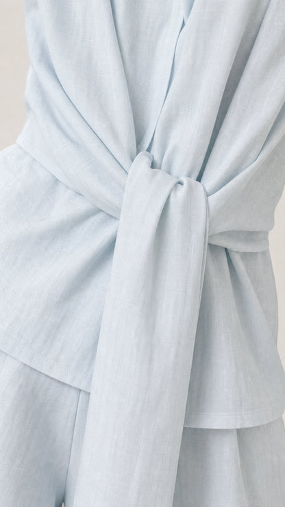 Close-up of the front tie knot on the light blue vest