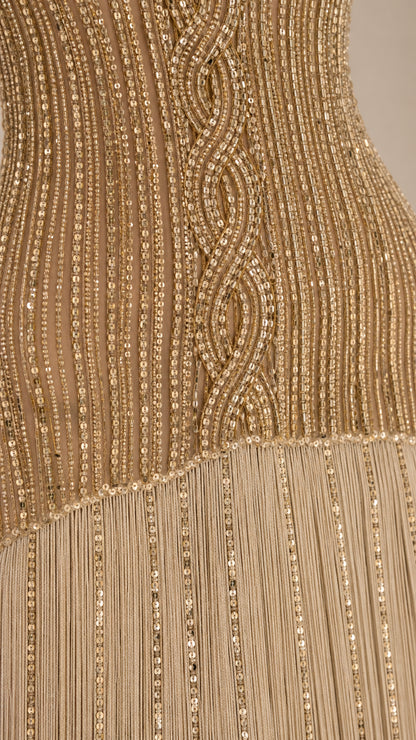 Close-up detail of the sequin embroidery and fringe texture