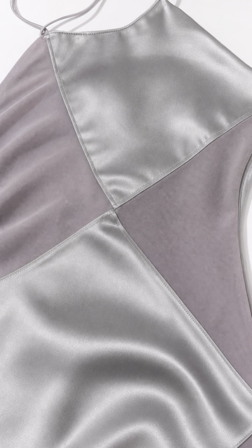 Close-up detail of geometric satin and sheer paneling
