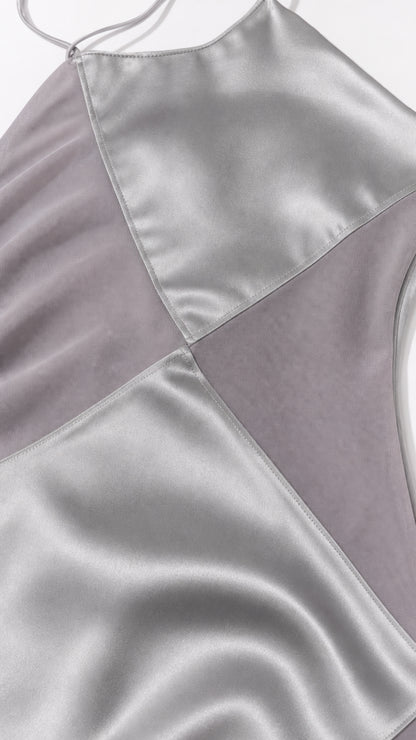 Close-up detail of geometric satin and sheer paneling