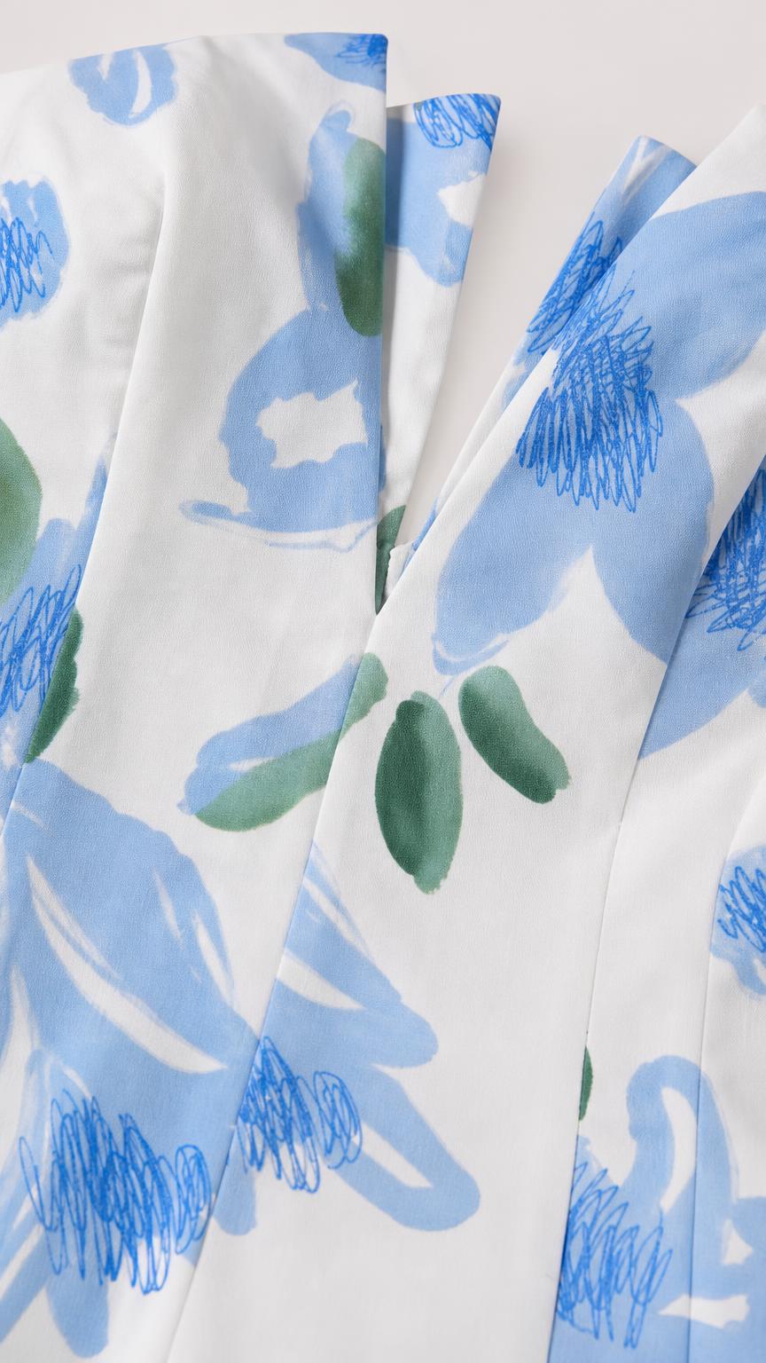 Close-up detail of white and blue floral woven fabric