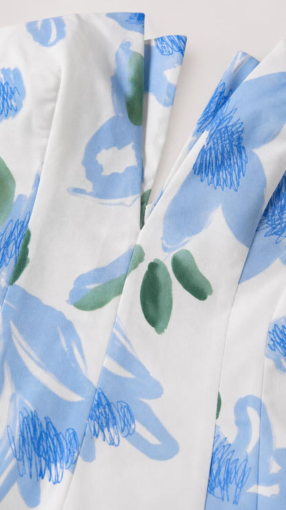 Close-up detail of white and blue floral woven fabric