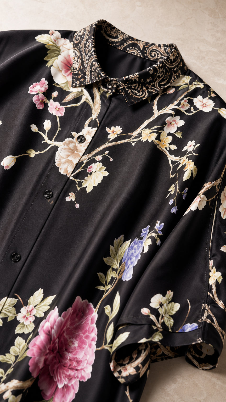 Close up detail of black floral satin shirt collar and button placket
