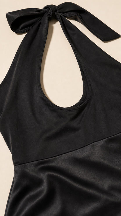 Close-up of the halter neckline and satin waistband detail