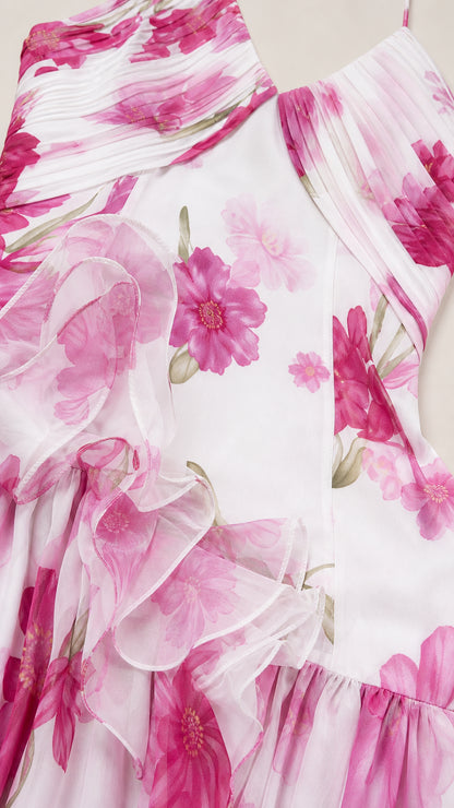 Close-up detail of white floral chiffon fabric and ruffles