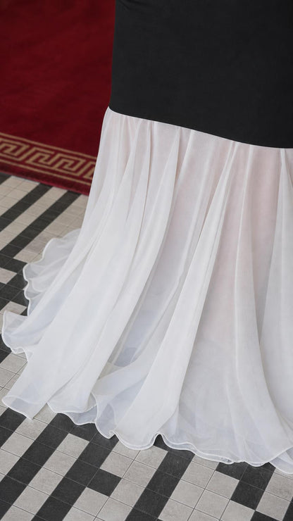Close-up detail of the sheer white chiffon skirt hem
