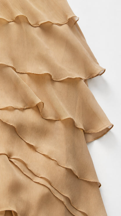 Close-up detail of beige chiffon layered ruffles