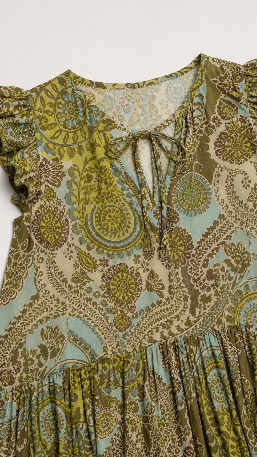 Close-up of neckline, tie detail, and ruffle cap sleeve on olive green paisley dress