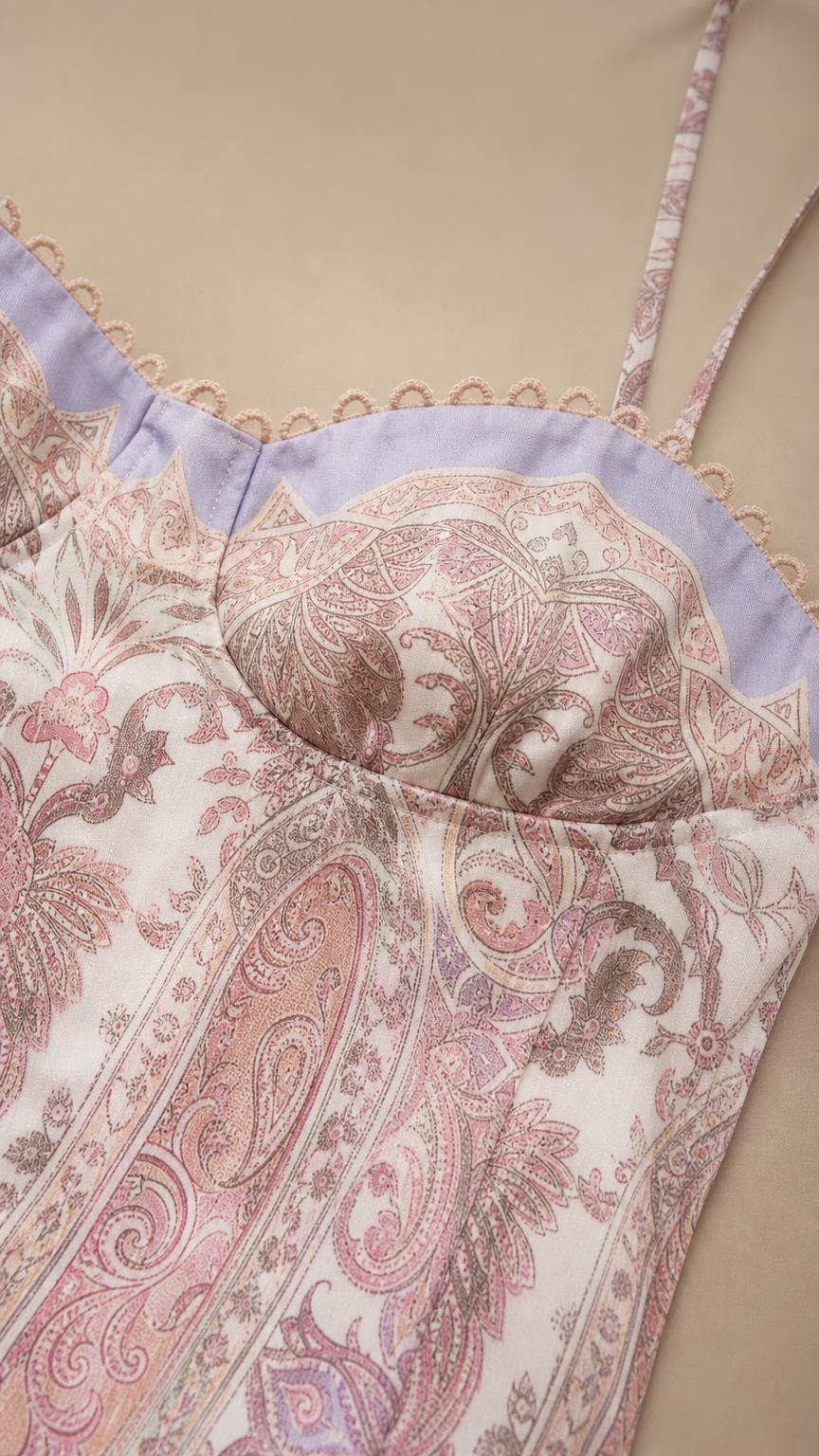 Close-up of bodice, sweetheart neckline, and paisley print fabric