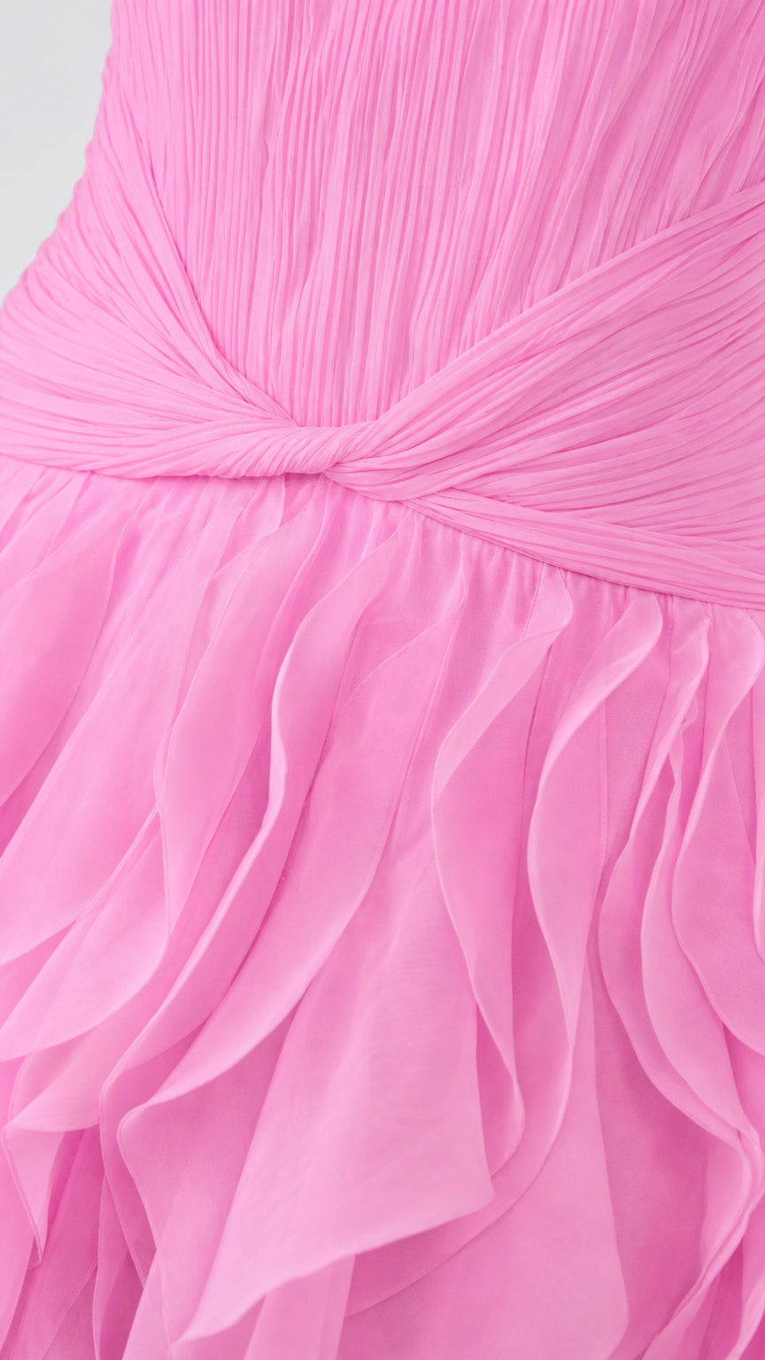 Close-up detail of the ruched bodice and layered ruffles in pink