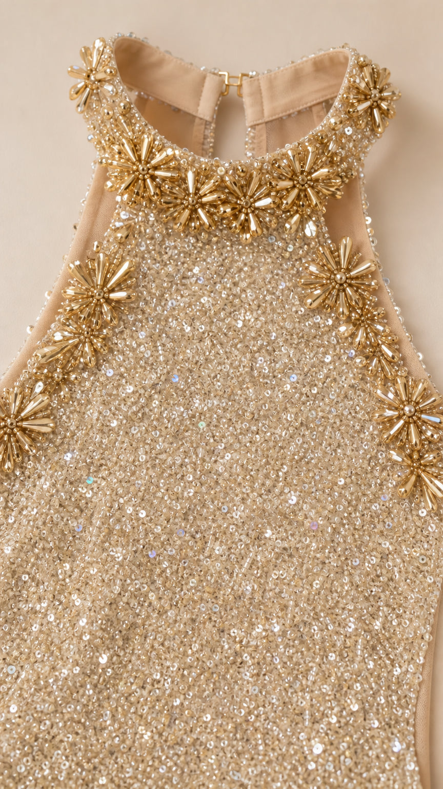 Close-up of crystal and bead starburst embellishments on halter neckline
