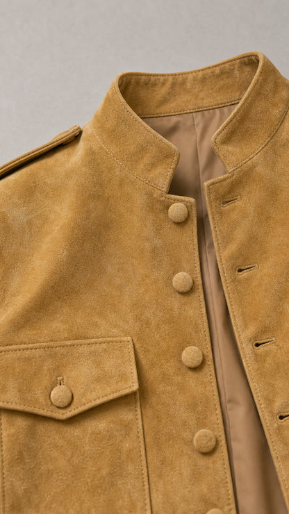 Close-up detail of collar and buttons on camel jacket