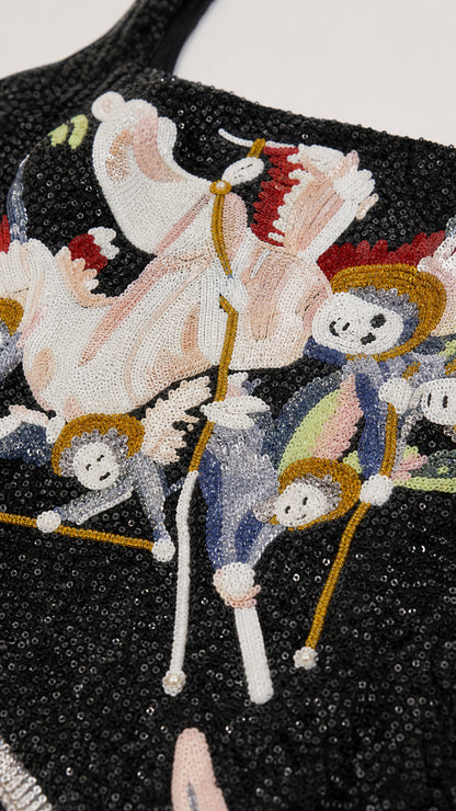 Close up view of colorful beadwork and mythological graphic detail