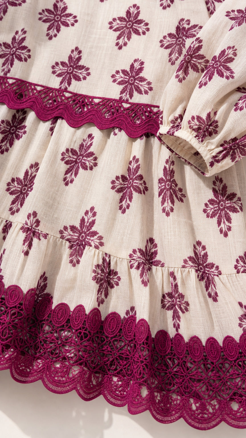 Close-up detail of embroidered hem and fabric texture