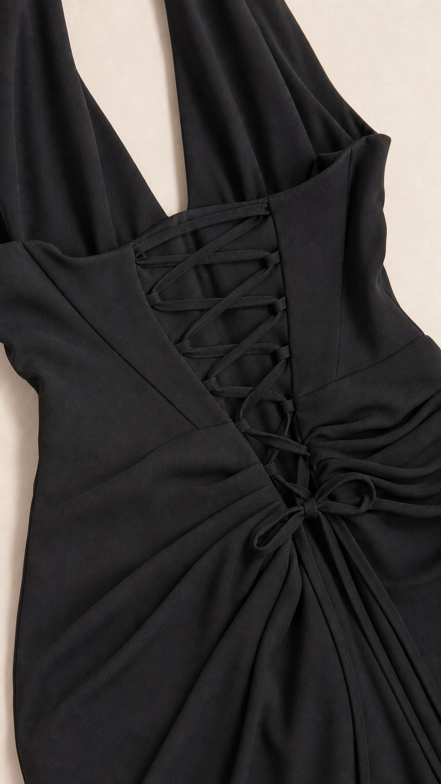 Close-up of the back lace-up closure and draped waist