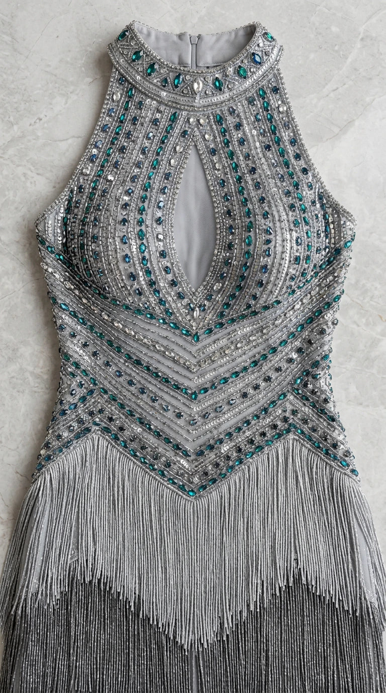 Detailed close-up of beaded bodice with keyhole cutout and crystal accents