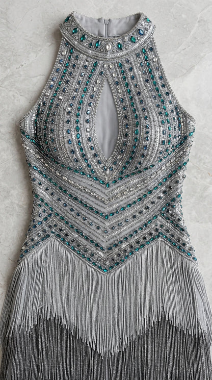 Detailed close-up of beaded bodice with keyhole cutout and crystal accents