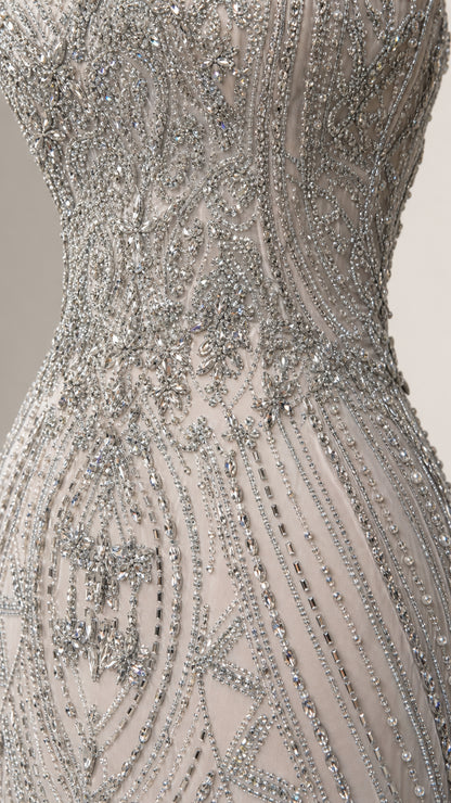 Close-up detail of intricate silver beading and sequin embellishments