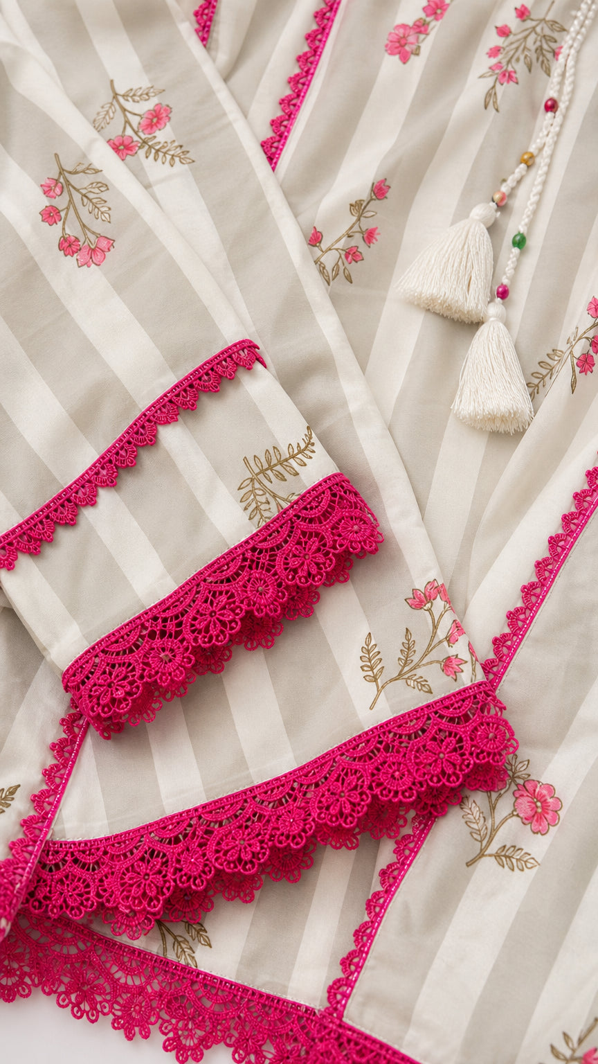 Close-up detail of lace trim and floral print on white kurti sleeves