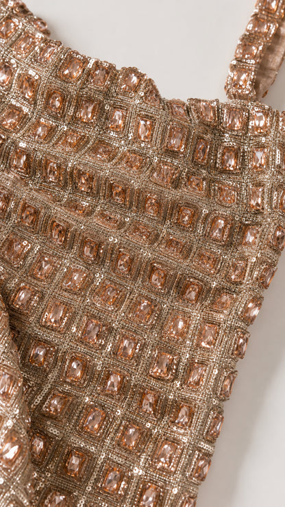 Close-up detail of geometric faceted crystal and bead embellishments