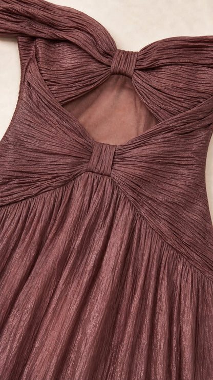 Close-up of textured fabric and bow-accented back cutout