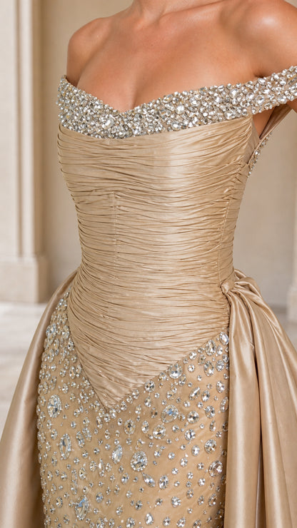 Close-up detail of crystal-beaded off-the-shoulder neckline and ruched bodice in Champagne