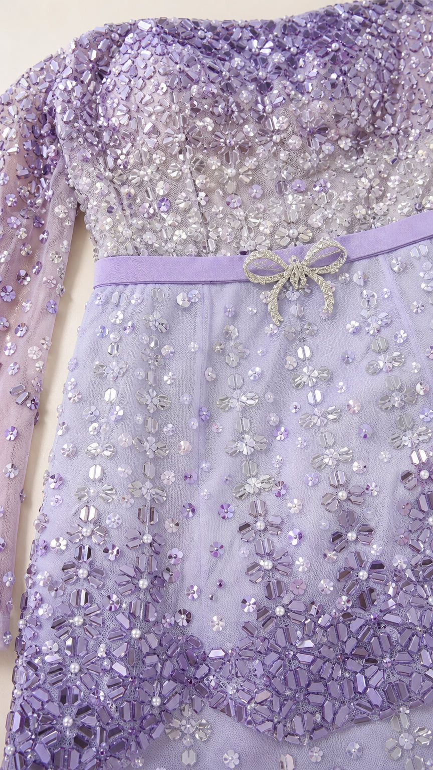 Close-up of beaded bodice and waist bow detail on lavender gown