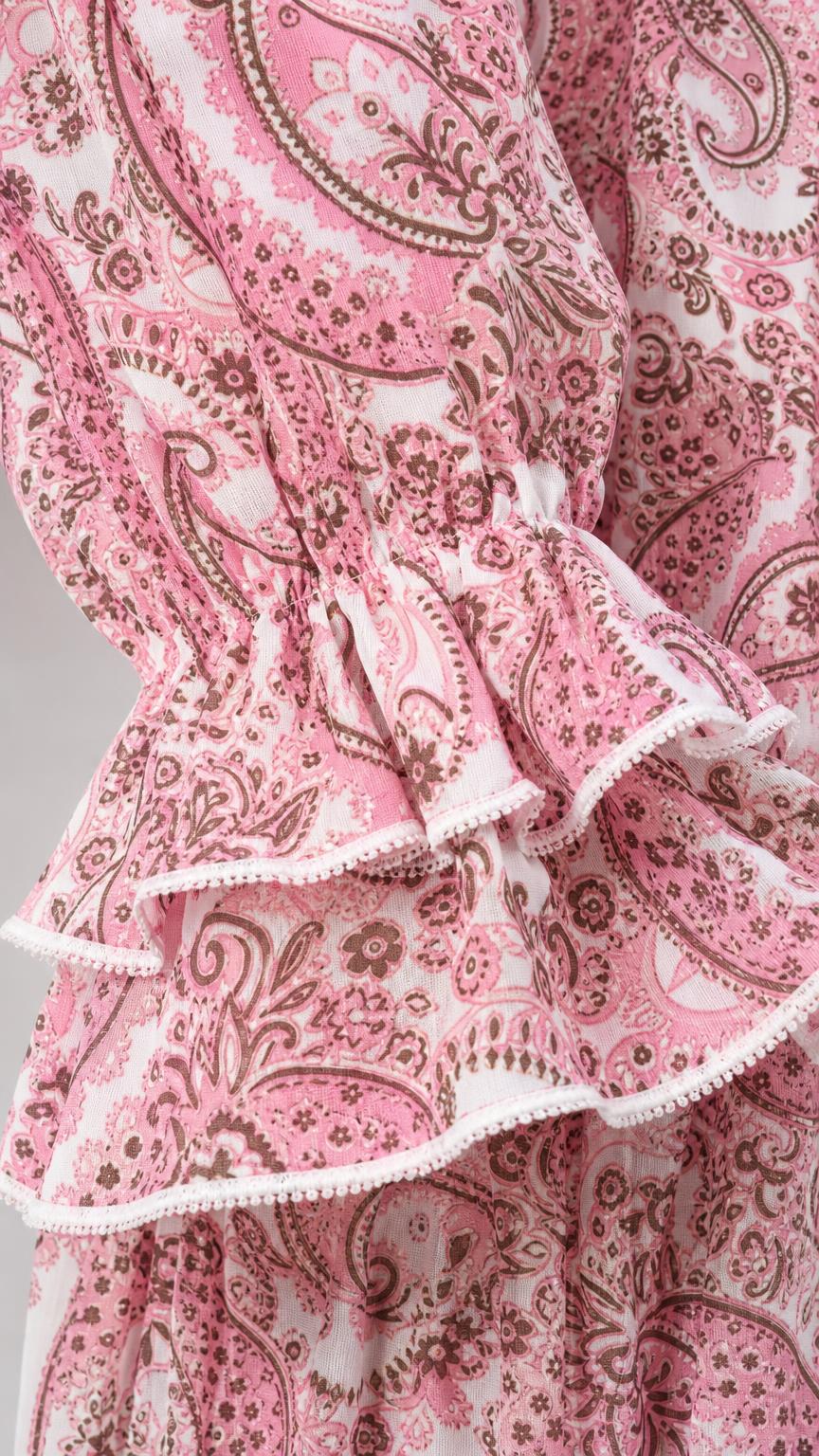 Close-up detail of tiered ruffled sleeve cuff with pink paisley print