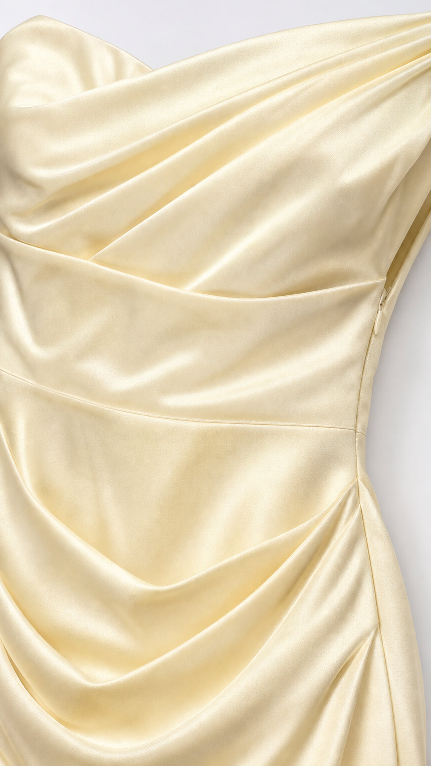 Close-up detail of bodice draping on satin dress