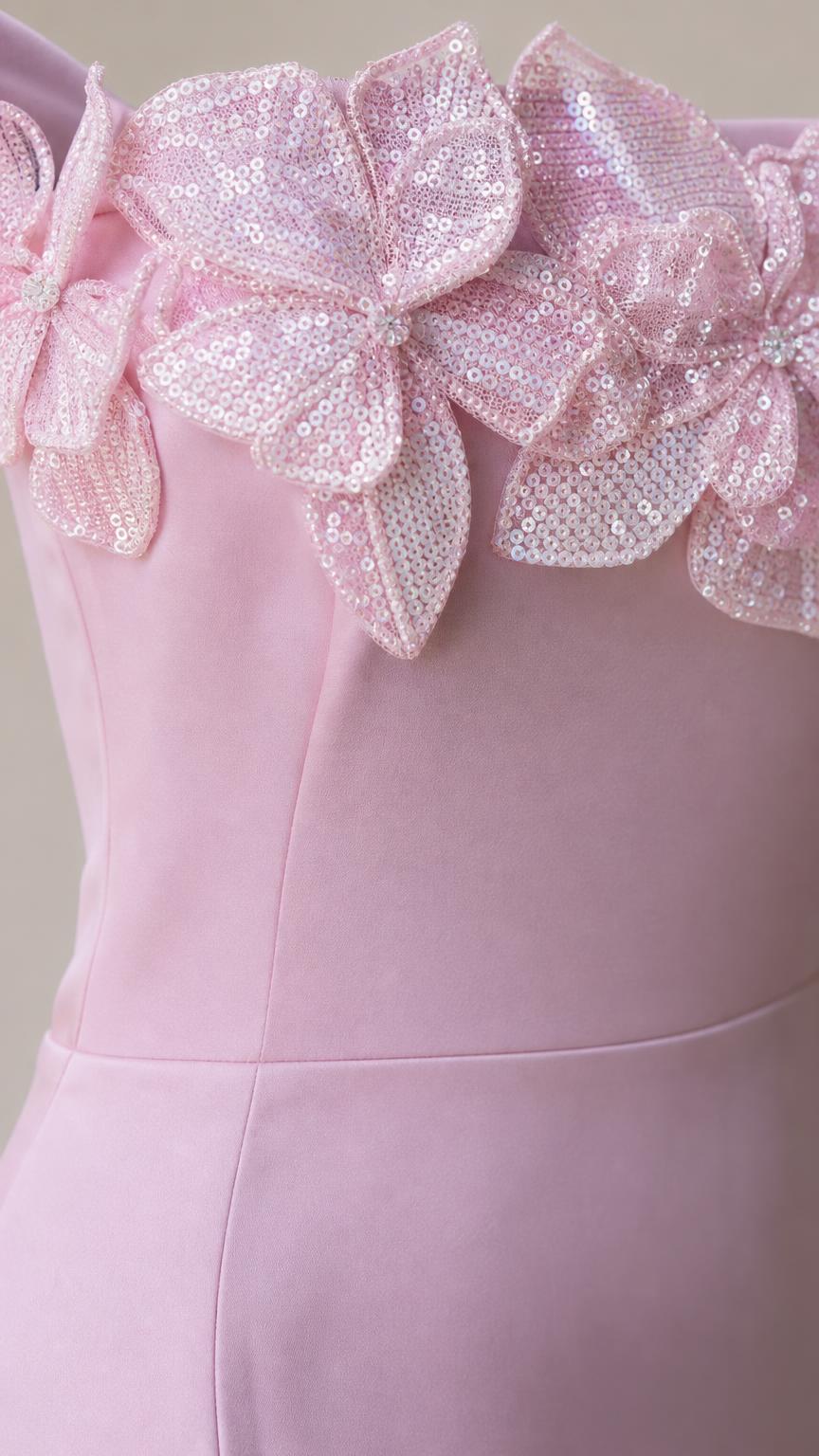 Close-up detail of 3D sequined flower appliques on the bodice