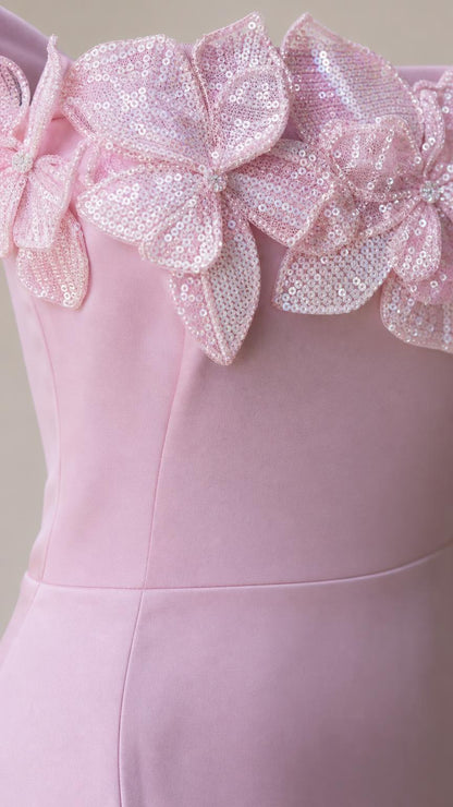 Close-up detail of 3D sequined flower appliques on the bodice