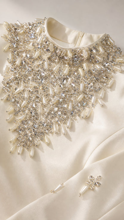 Detailed close up of pearl and crystal bead embroidery on the neckline