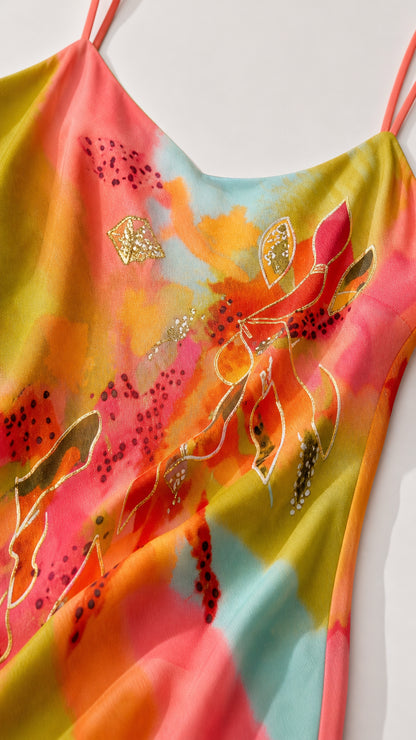 Close-up detail of watercolor floral pattern and delicate strap construction