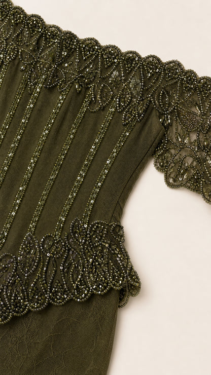 Close-up detail of beaded bodice and off-shoulder neckline