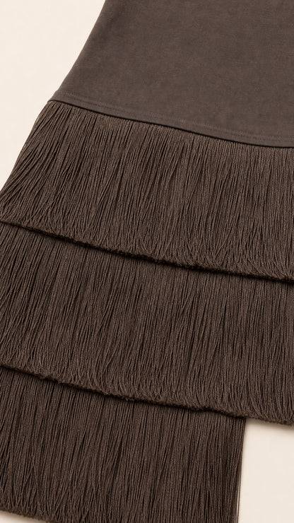 Close-up detail of mocha brown stretch fabric and layered fringe hem