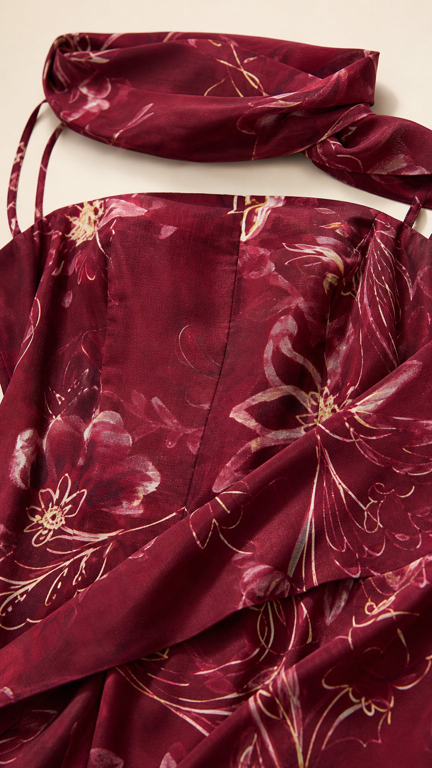 Close up of fabric texture and matching scarf for burgundy dress