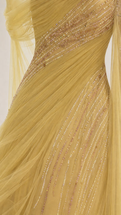 Close-up detail of sequin and bead embellishments on yellow dress