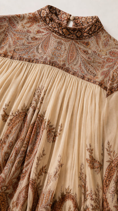 Close-up detail of high neckline, vintage paisley yoke, and micro-pleated fabric