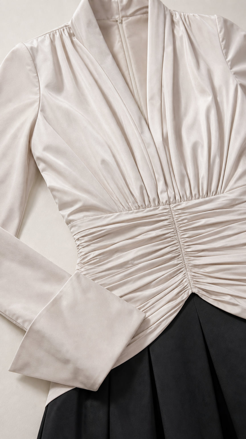 Close-up detail of bodice ruching and sleeve cuffs