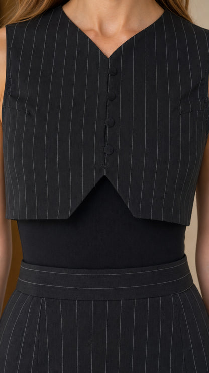 Close-up detail of black pinstripe vest top and waistband