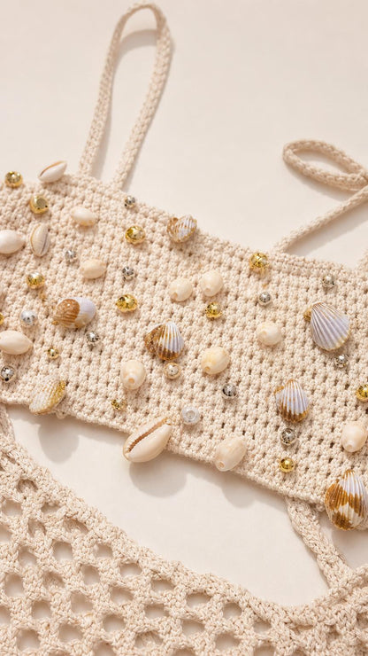 Close-up detail of seashell and bead bodice embellishments