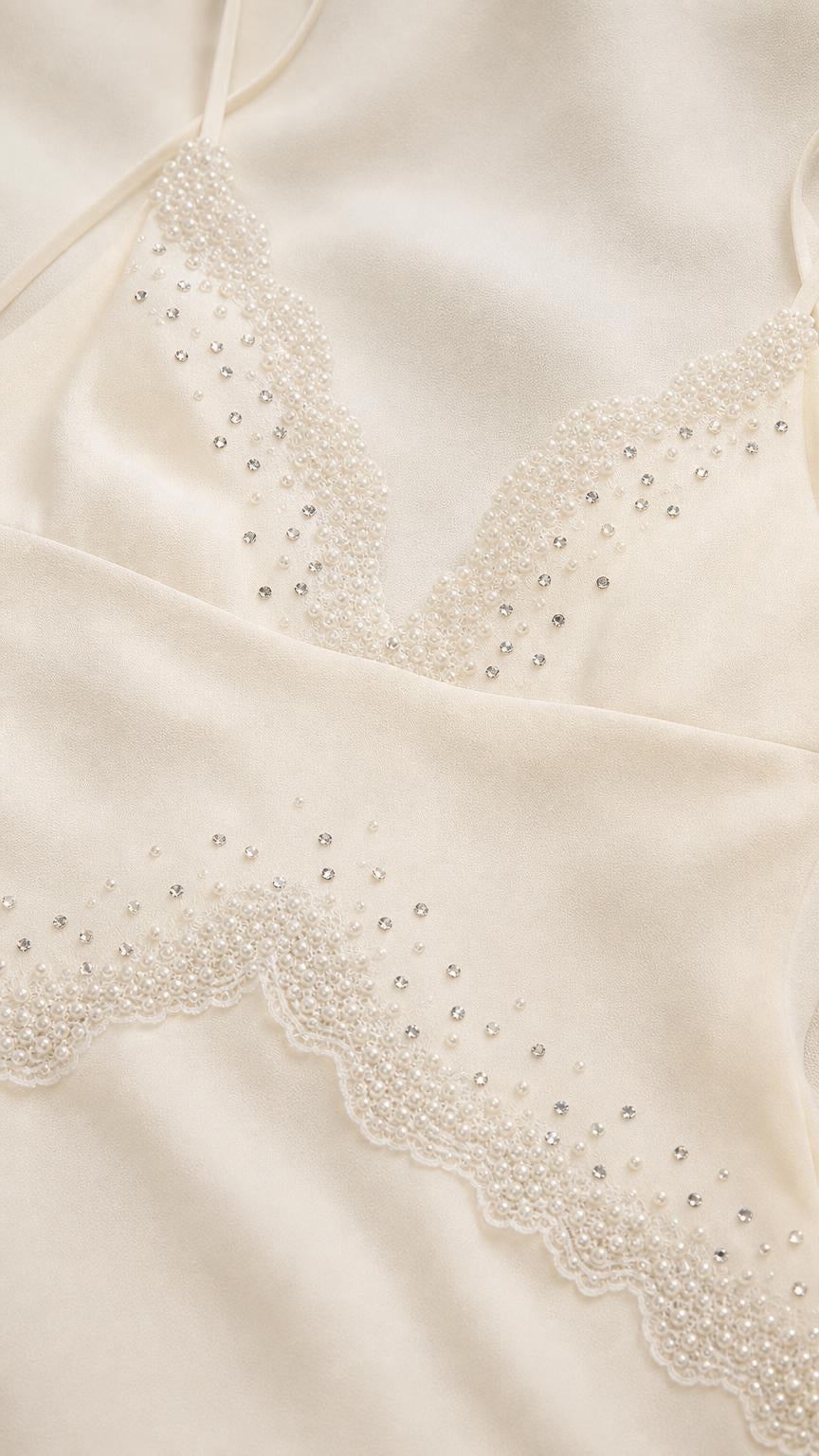 Close-up detail of beaded V-neckline and trim
