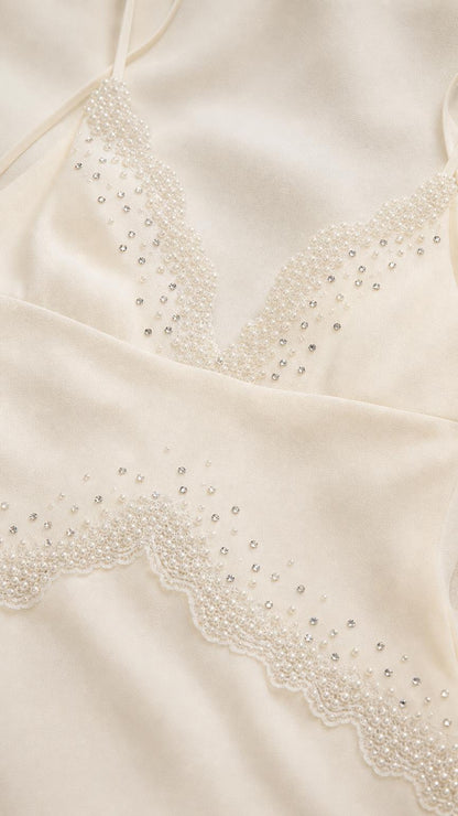 Close-up detail of beaded V-neckline and trim