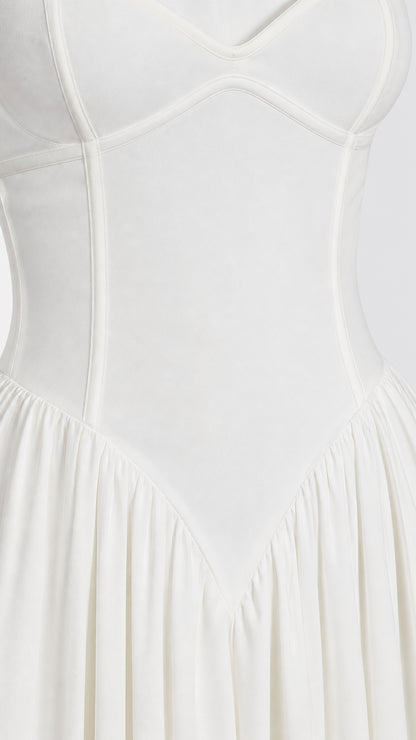 Close-up of structured bodice paneling on white dress