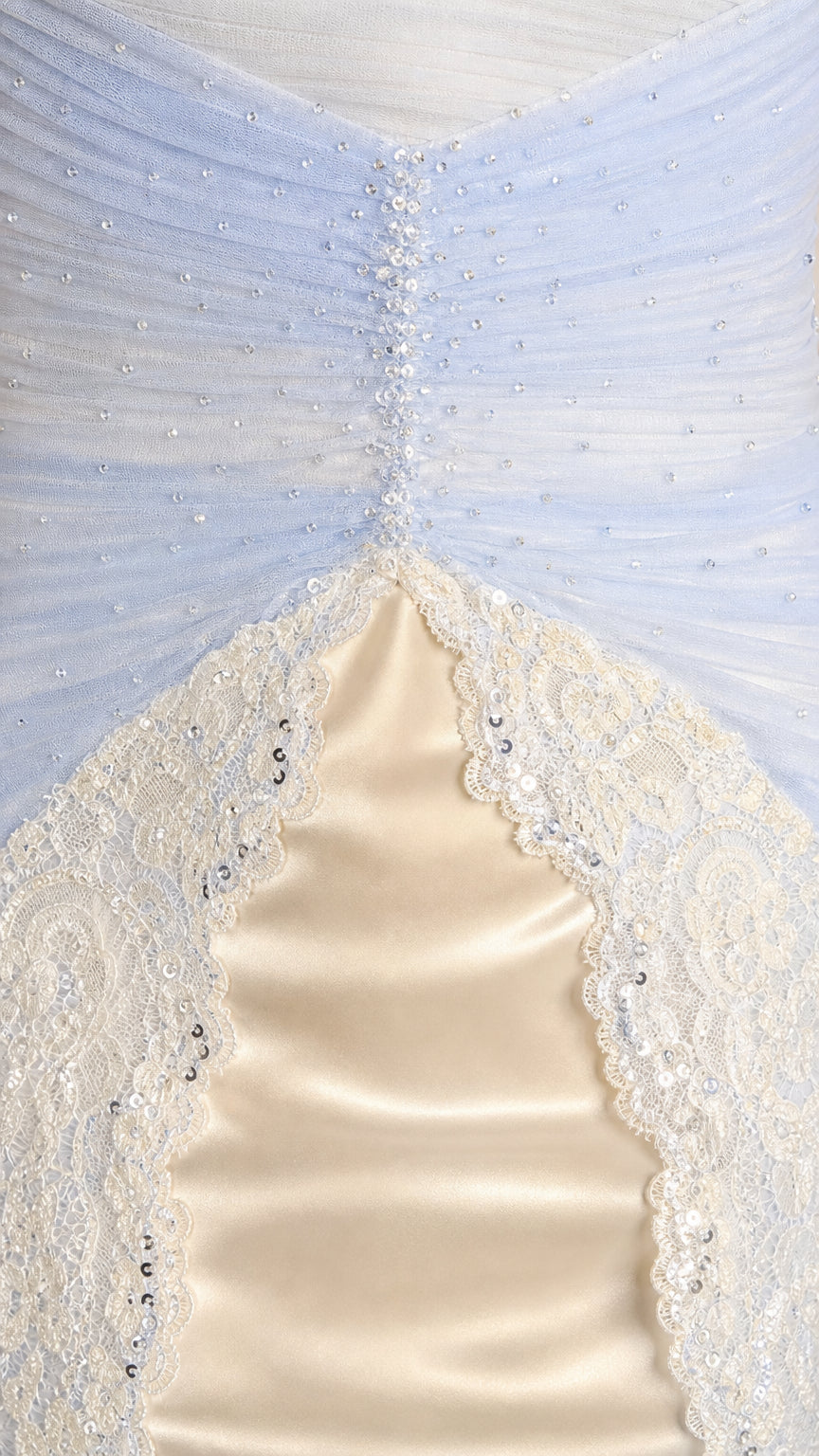 Close-up detail of ruched tulle bodice, beaded center accent, and scalloped lace trim