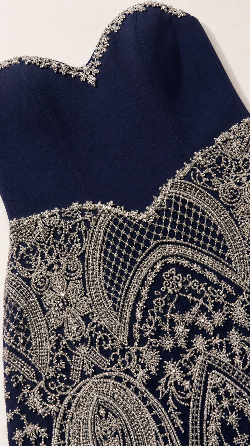 Close-up detail of beaded sweetheart neckline and intricate filigree embroidery