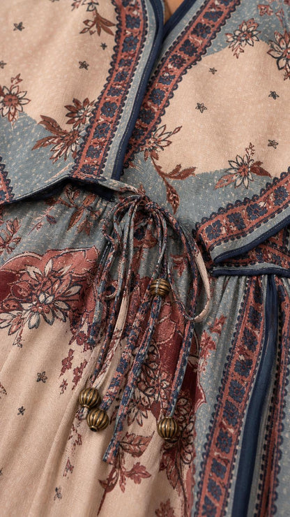 Close-up of beaded drawstring and print detail