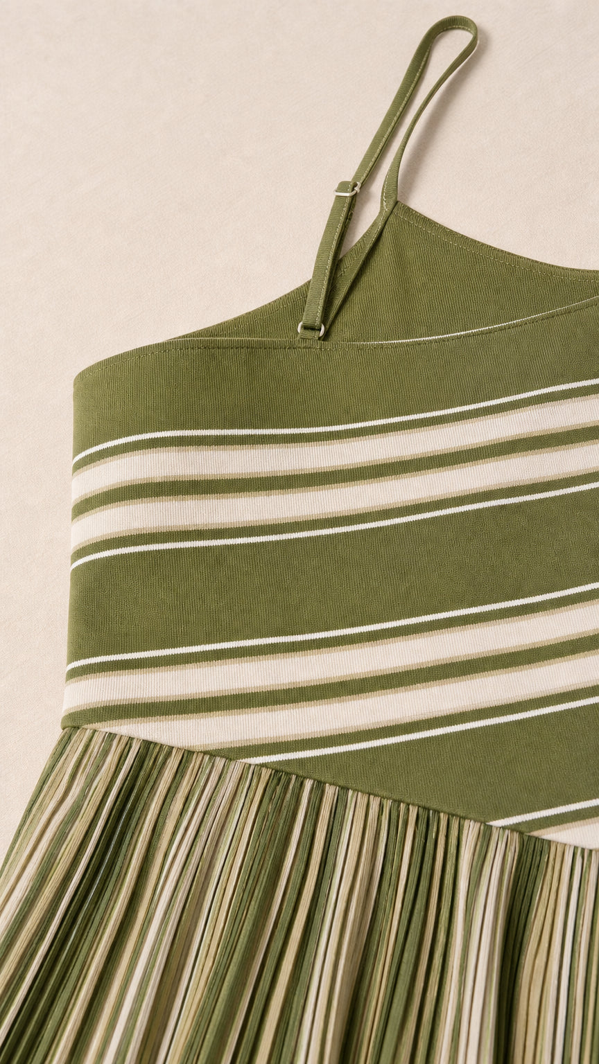 Close-up detail of olive green striped knit dress straps and bodice