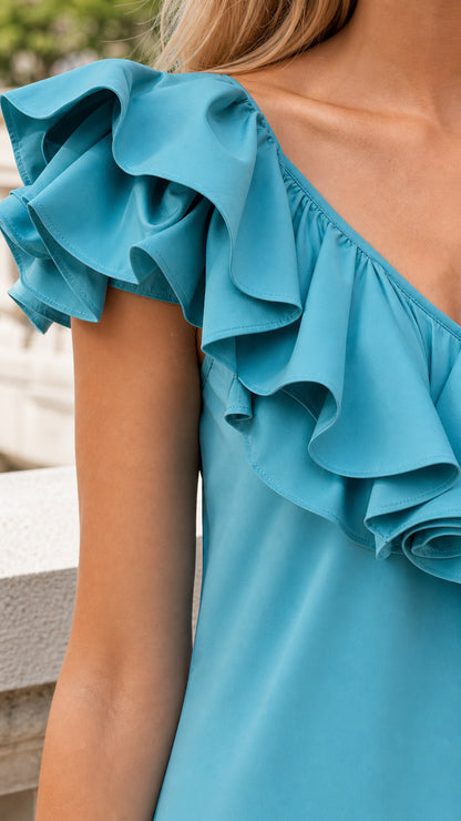 Close-up detail of shoulder ruffles in blue