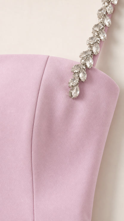 Close-up detail of crystal rhinestone embellishments on dress shoulder strap